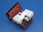 Place the Sintra piece between the motors like so.