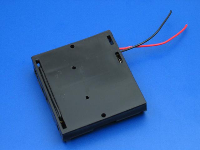 The back side of the battery pack with the holes drilled.