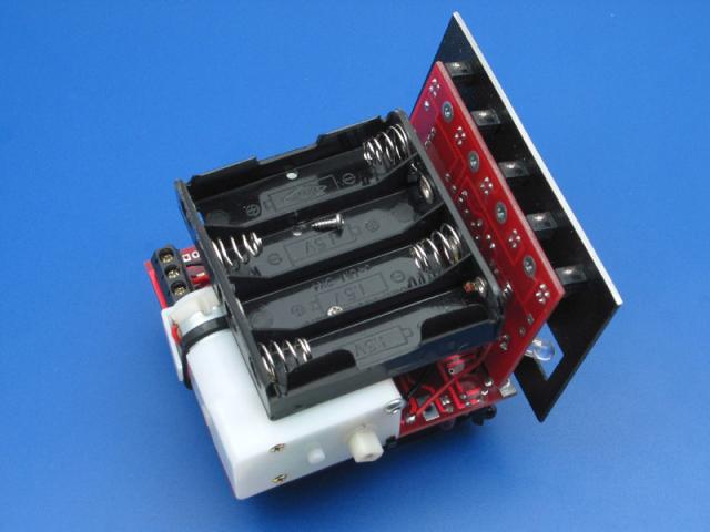 Mounting the battery pack to the sintra with 1/4" screws.